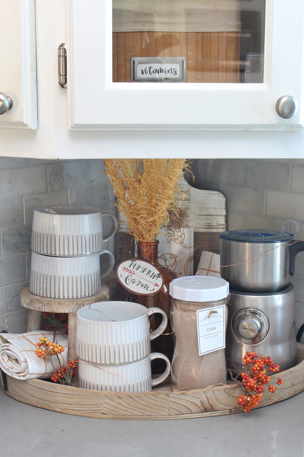 Fall beverage station in a white kitchen.