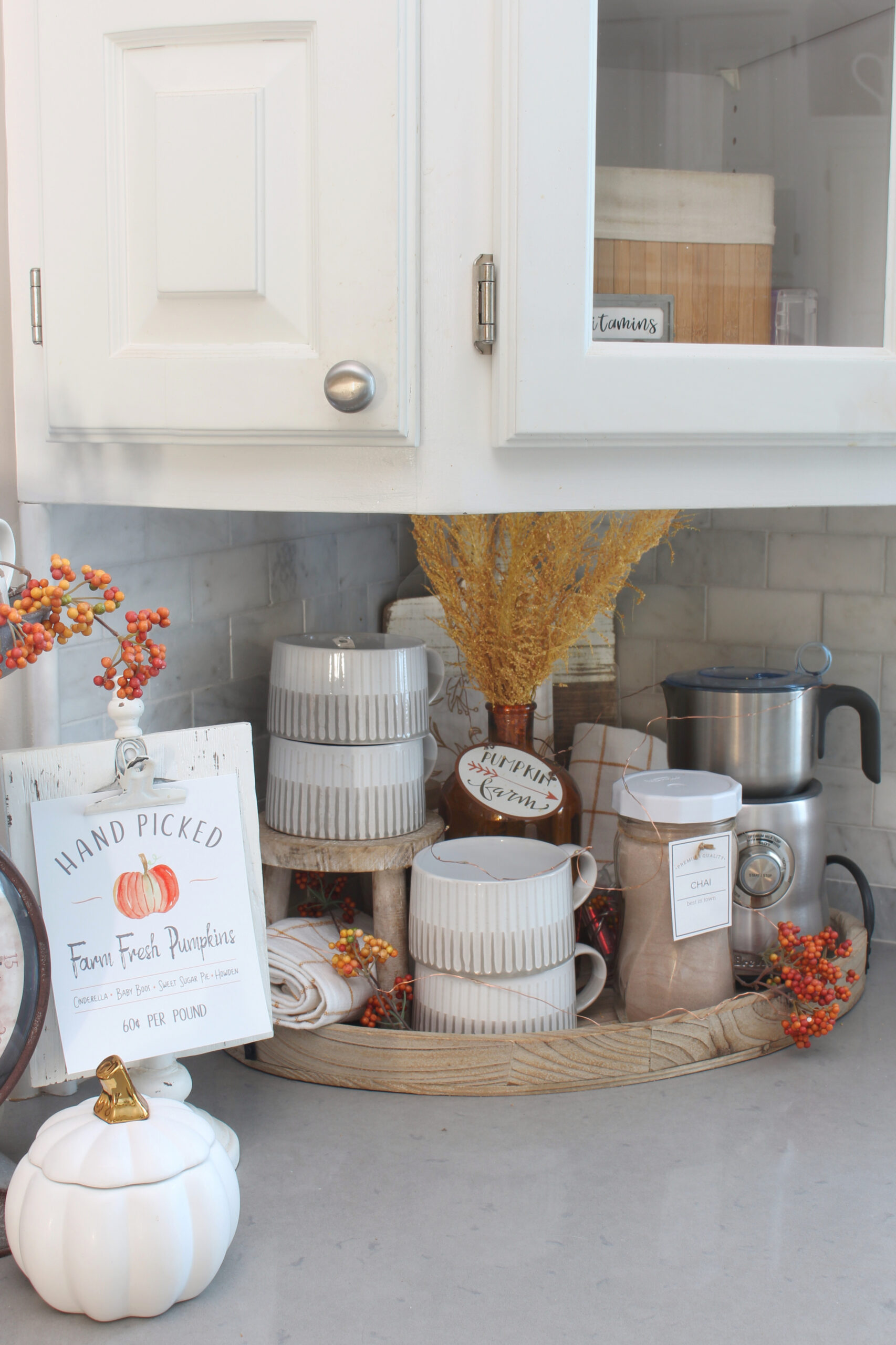 Fall beverage station in a white kitchen.