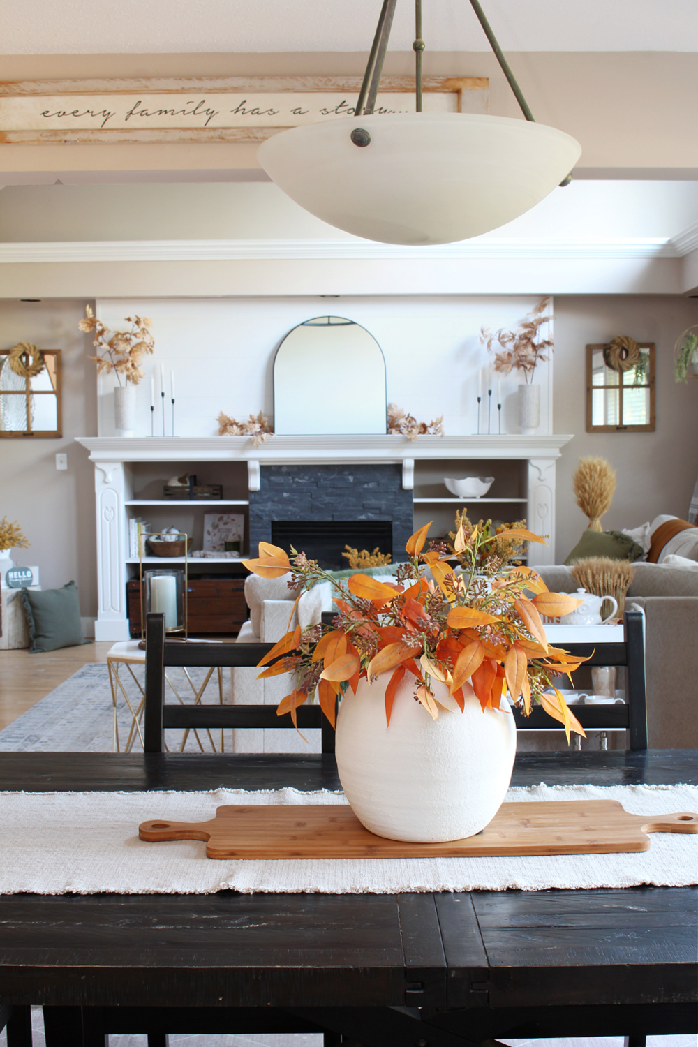 Fall foliage in a white vase for a simple fall centerpiece.
