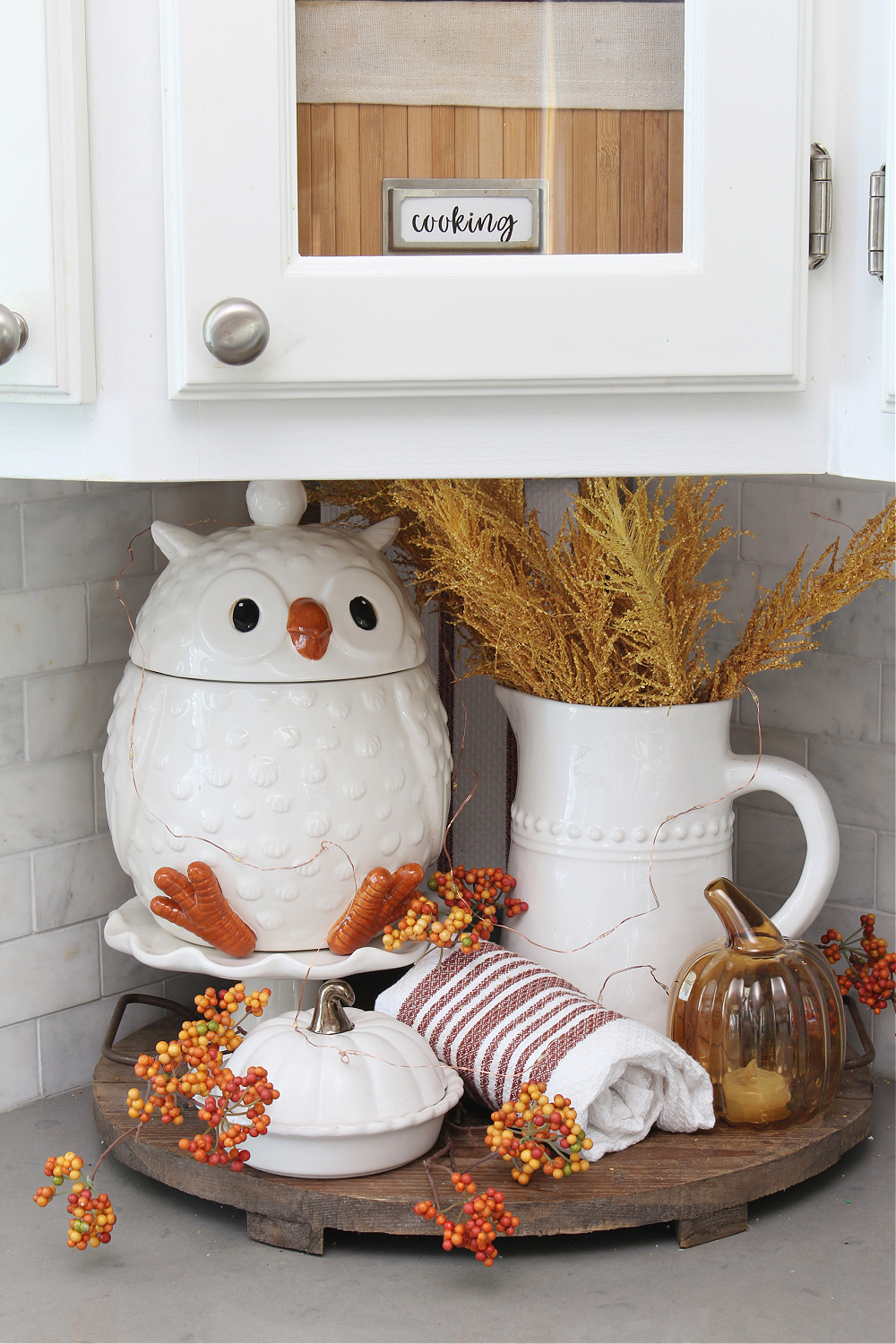 Cute fall kitchen vignette with owl cookie jar.