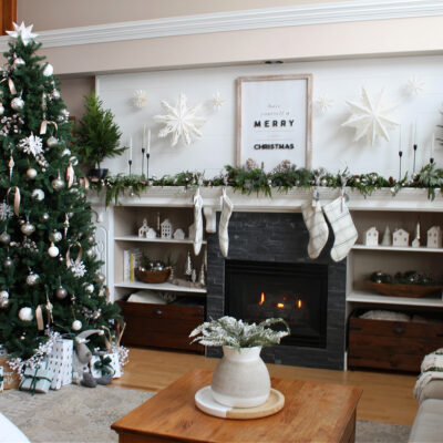 Living room decorated for Christmas with green and white.