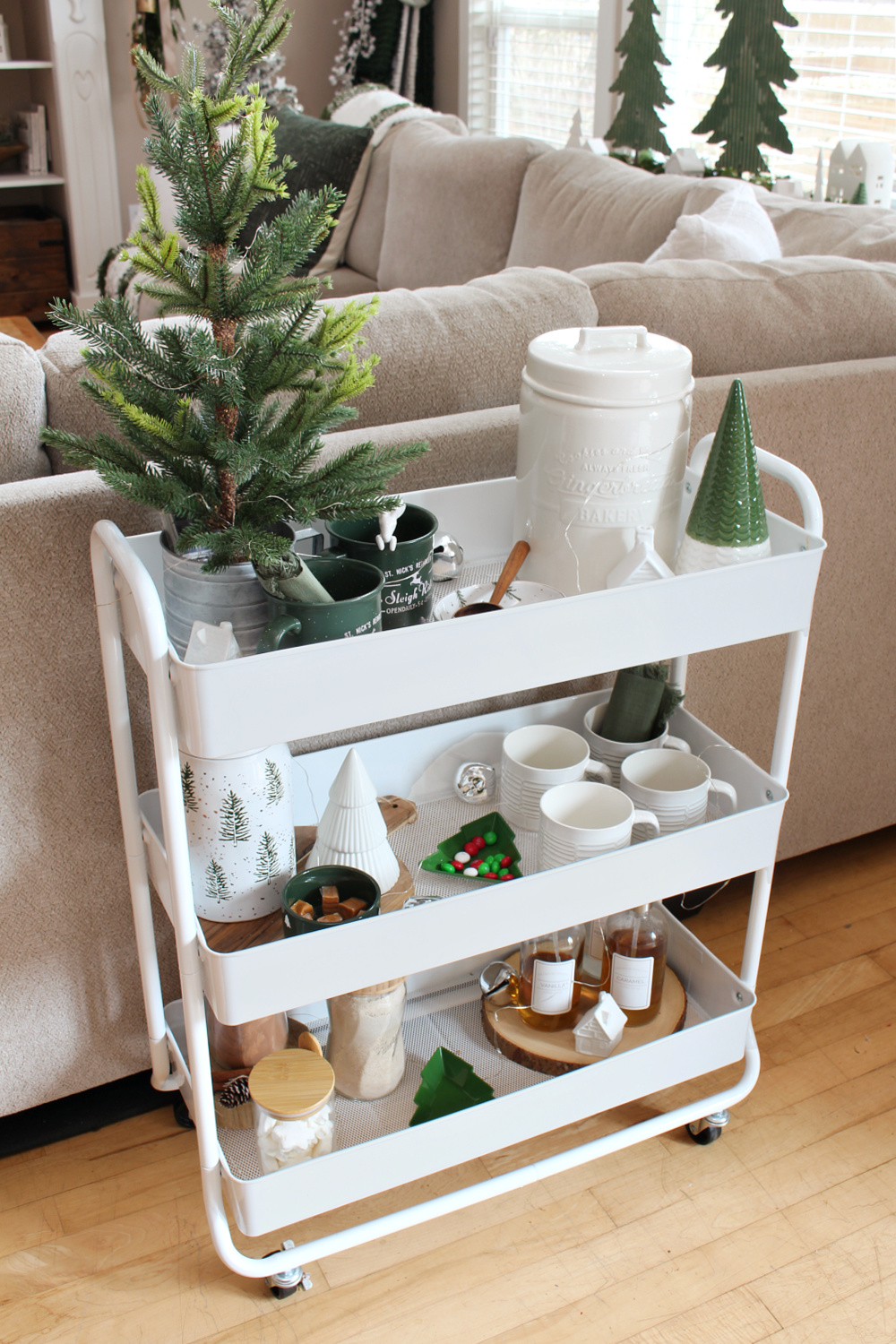 Hot chocolate bar cart decorated in green and white.