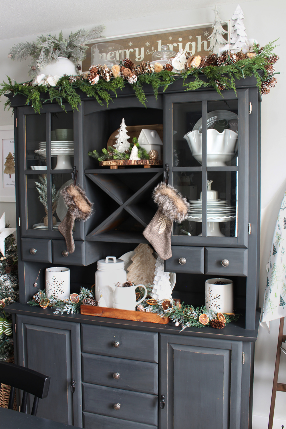 Black painted buffet and hutch decorated for Christmas.