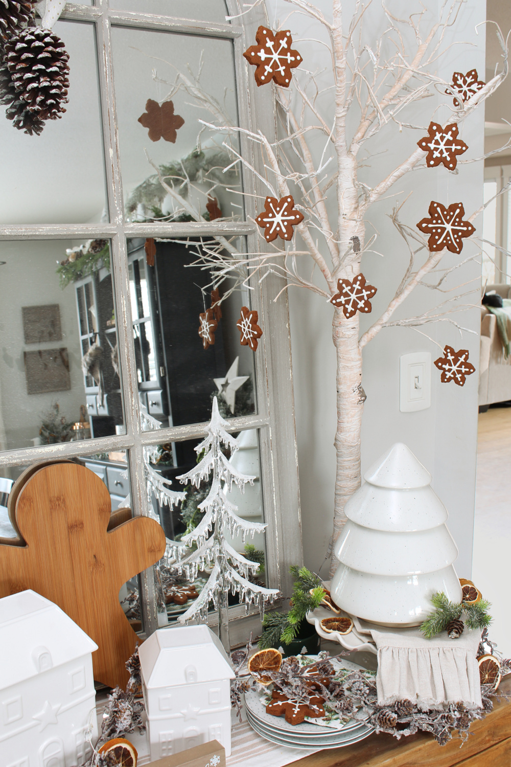 Handmade faux gingerbread snowflakes hanging from a Christmas sideboard tree.