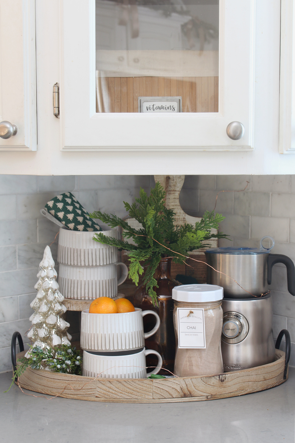 Christmas hot beverage bar in a white kitchen.