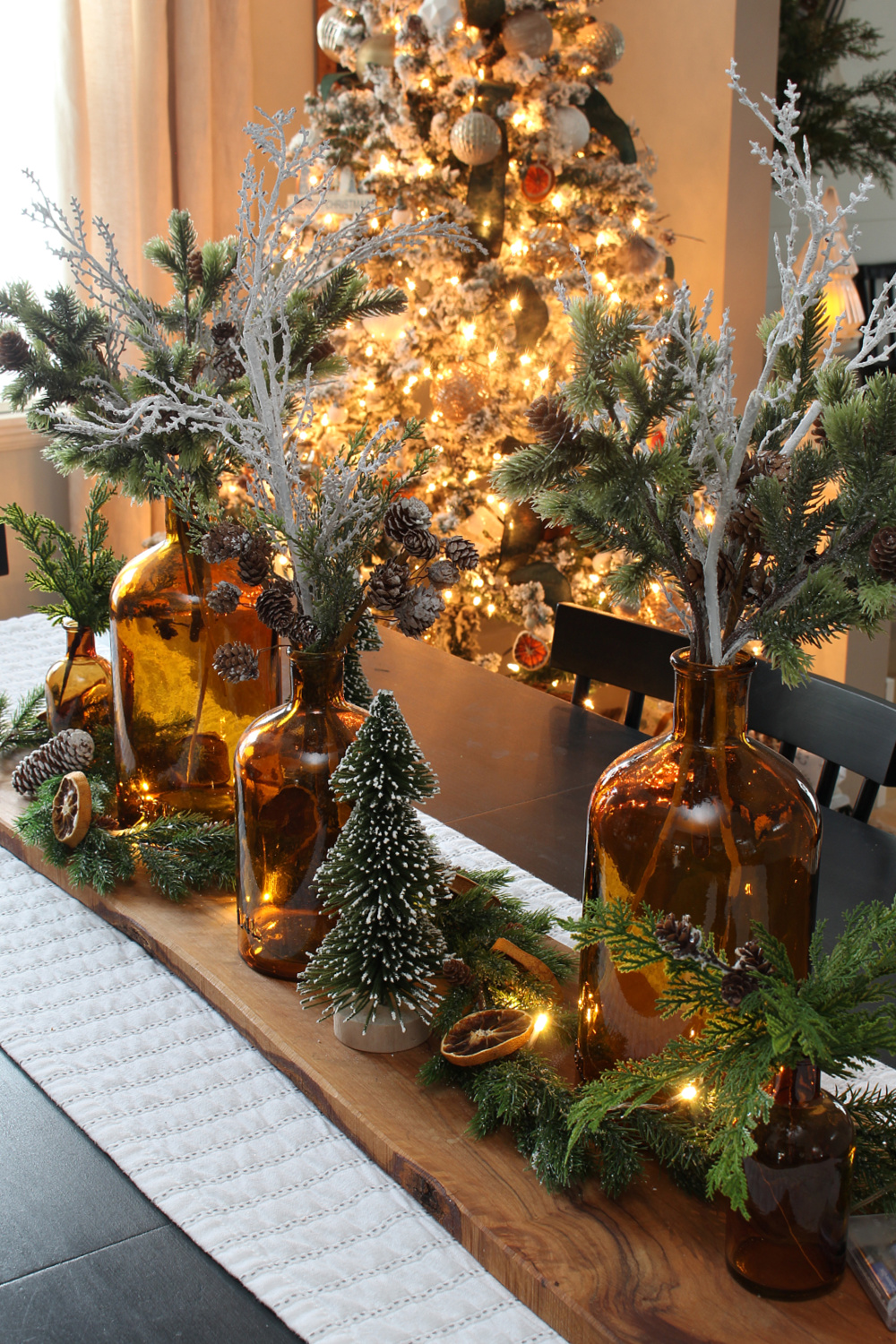 Amber glass centerpiece lit up with Christmas lights.